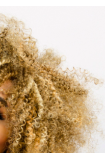 Blond super curly afro-textured hair.